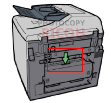 Xử lí lỗi kẹt giấy máy photocopy Ricoh - bộ đảo 2 mặt (Duplex Unit): Nhấn nút nắp thiết bị in hai mặt ở giữa khay nạp tay ở vị trí như hình minh họa, sau đó mở nắp thiết bị in hai mặt.